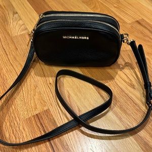 MK camera cross body bag
